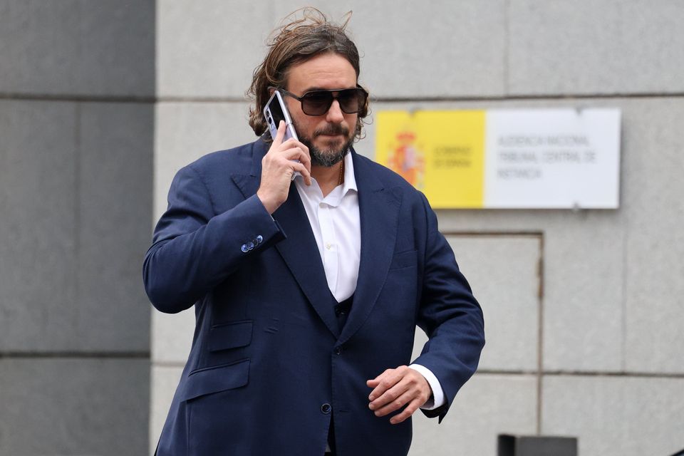 Francisco de Borbon makes a phone call outside court in Madrid, after being granted bail. Photo: Getty